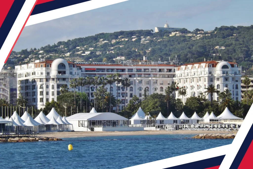 Hôtel Barrière Le Majestic Cannes with beach tents along the Croisette