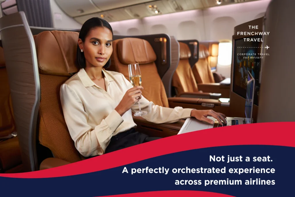 Businesswoman enjoying champagne in Air France business class seat, representing premium travel experience