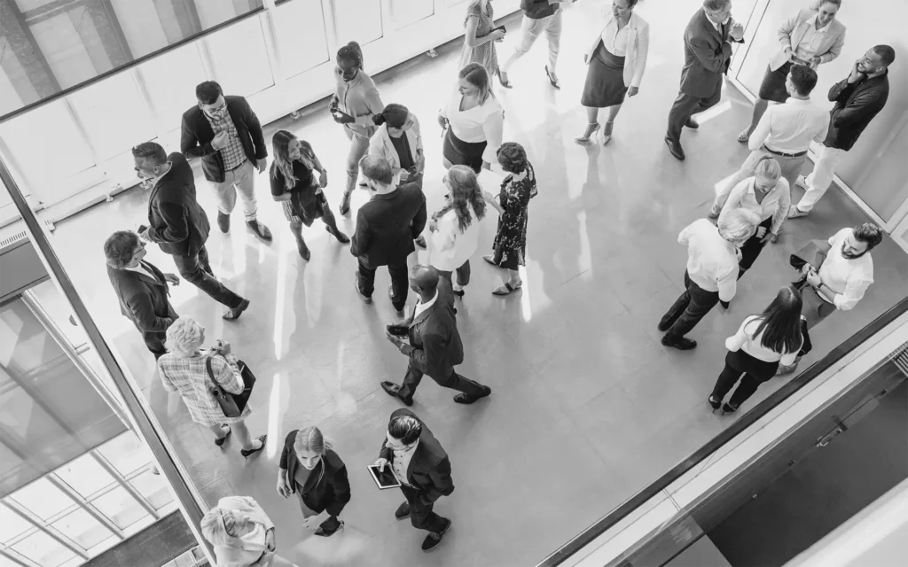 Overhead view of people networking and socializing at a professional event.