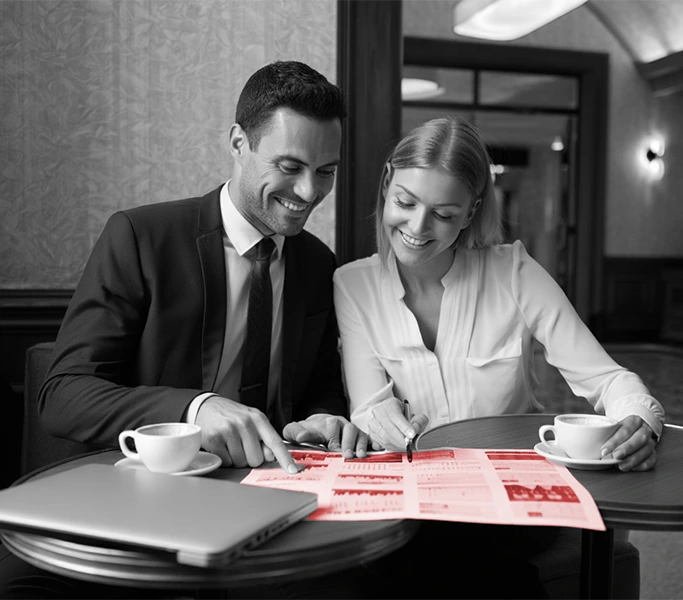 Corporate travel agents reviewing expense reports — budget planning for business trips