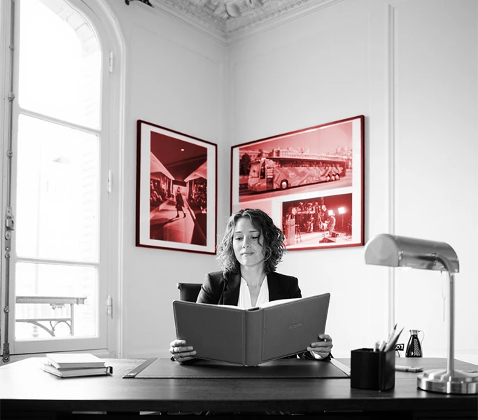 Travel consultant reviewing portfolio — personalized travel planning for corporate clients