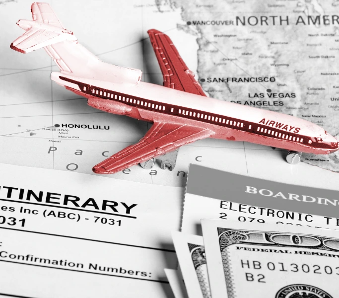 Plane on map with boarding pass and cash — international business travel itinerary planning