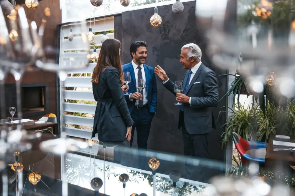 Luxury corporate incentive event in France with executives networking at a high-end venue, Frenchway Travel incentive travel experience