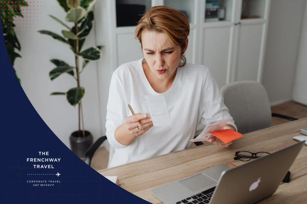 Woman reviewing receipts and expenses illustrating challenges of manual travel reimbursement processes