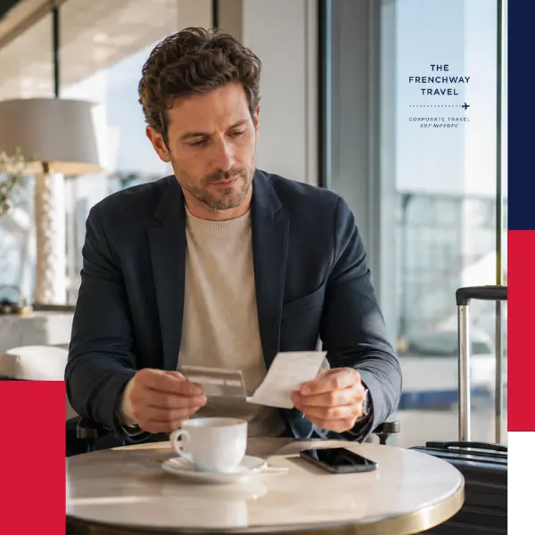 Business traveler reviewing a receipt and payment card during a corporate trip.