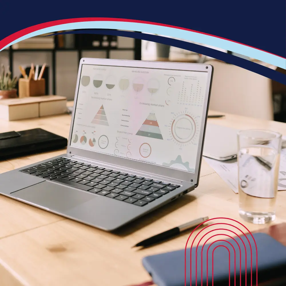 Laptop showing business analytics dashboard for corporate travel expense management.