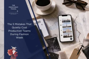 Editorial cover image for a Frenchway Travel article about common Fashion Week production travel mistakes, showing a luxury travel planning flat lay with smartphone itinerary, city maps, coffee, fashion sketches, fabric swatches, and travel documents.